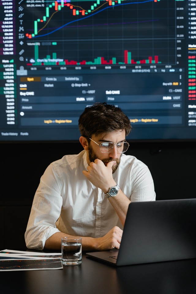 Person thinking over a computer